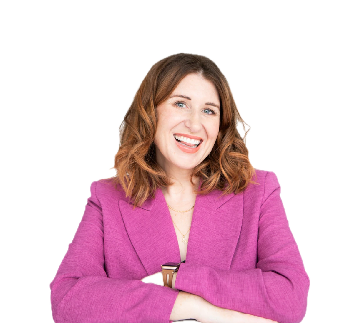 Rachel Gronback in a magenta blazer, leaning on her desk, laughing